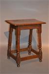 An elegant Queen Anne oak joint stool.