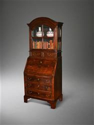 A very small George I oak bureau bookcase. A very small George I oak bureau bookcase.