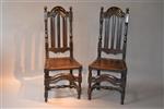 A fine pair of William III oak high back chairs.