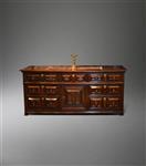 An impressive Charles II oak low dresser. 