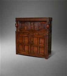 A Charles II oak two part press cupboard.  A Charles II oak two part press cupboard.