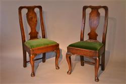 A pair of George II walnut side chairs. A pair of George II walnut side chairs.