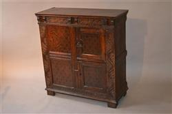A Charles II oak livery cupboard.  A Charles II oak livery cupboard.