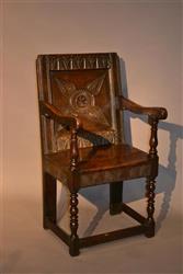 A Charles I oak armchair. A Charles I oak armchair.