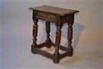 A very rare Charles I walnut joint stool.