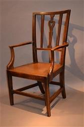 An exquisite George III elm armchair.  An exquisite George III elm armchair.