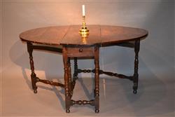 A Queen Anne yew wood gateleg table. A Queen Anne yew wood gateleg table.