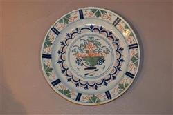 A Bristol delft polychrome charger. A Bristol delft polychrome charger.