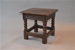 A rare mid 17th century oak low table. A rare mid 17th century oak low table.