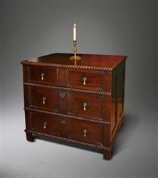 A small Charles II oak chest of drawers. A small Charles II oak chest of drawers.