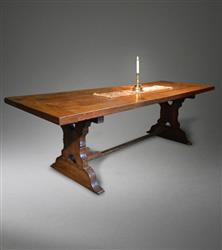 A mid 18th century oak and ash trestle table. A mid 18th century oak and ash trestle table.