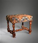 A fine Queen Anne walnut upholstered stool.