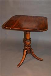 A Regency elm wine table. A Regency elm wine table.