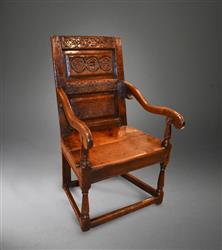An early Charles I oak armchair. An early Charles I oak armchair.