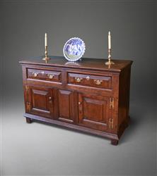 A very small mid 18th century oak dresser base. A very small mid 18th century oak dresser base.