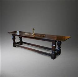 A 16th/17th century oak refectory table. A 16th/17th century oak refectory table.