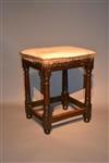 A rare Charles I oak upholstered stool.