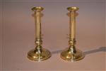 A pair of George III brass candlesticks. 