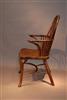 An 18th century yew wood double bow armchair.