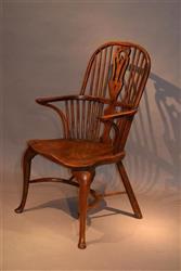 An 18th century yew wood double bow armchair. An 18th century yew wood double bow armchair.