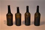 A collection of four ASCR wine bottles.