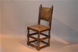 An early 17th century walnu Spanish side chair. An early 17th century walnu Spanish side chair.